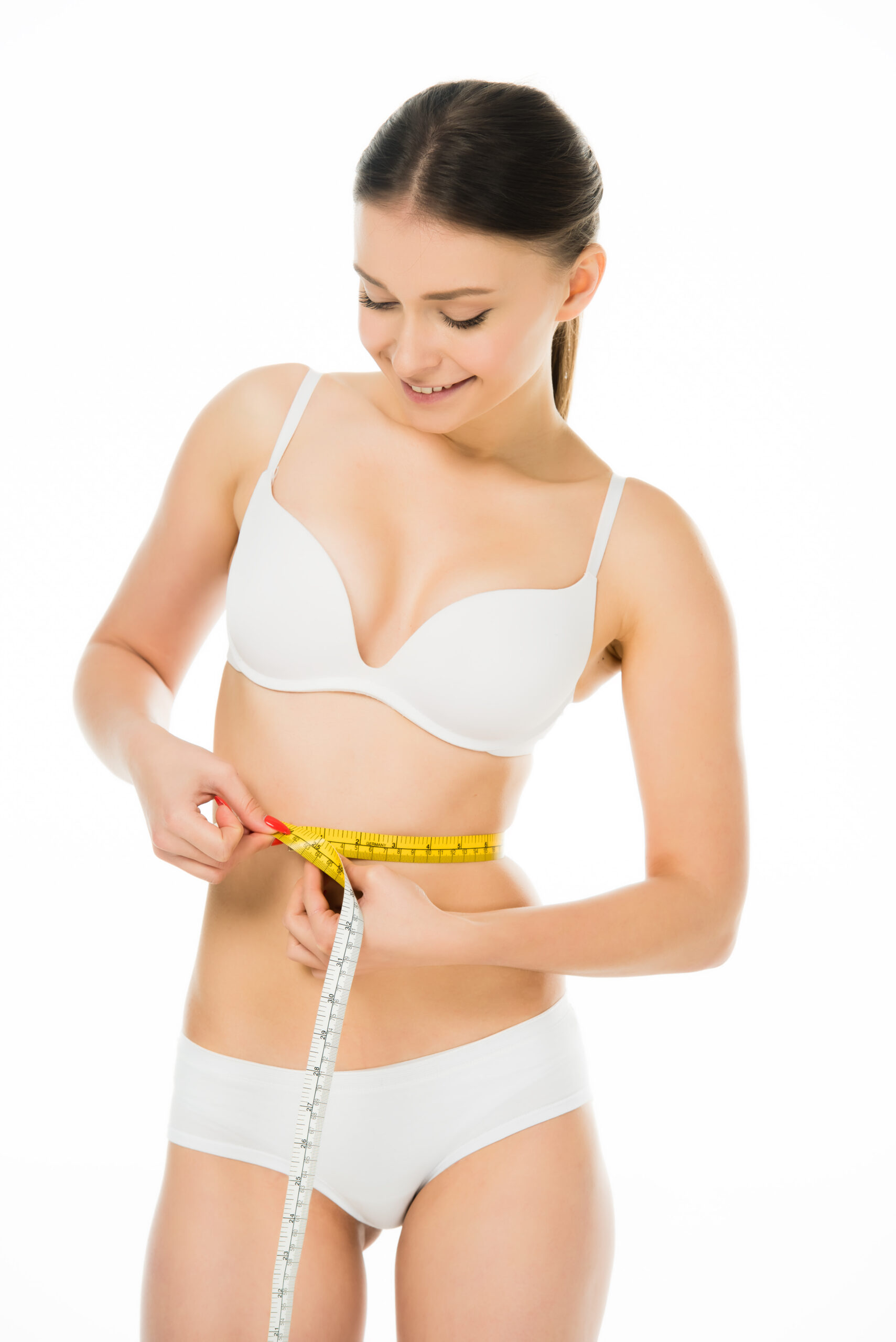 happy smiling slim woman measuring waist with centimeter isolated on white